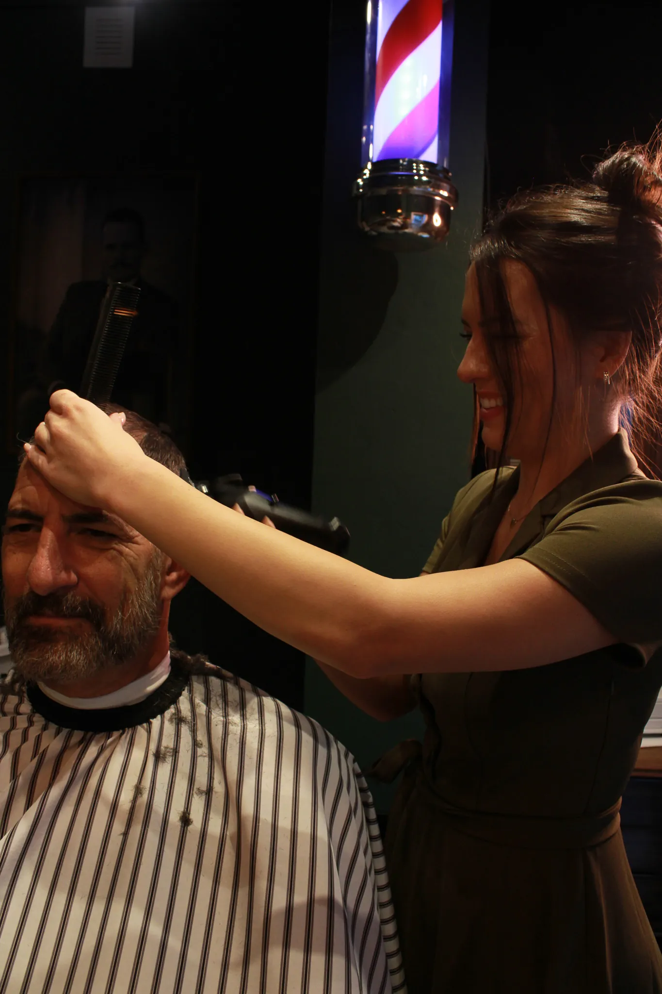 The barber chair and green styling room at Vintage Blade