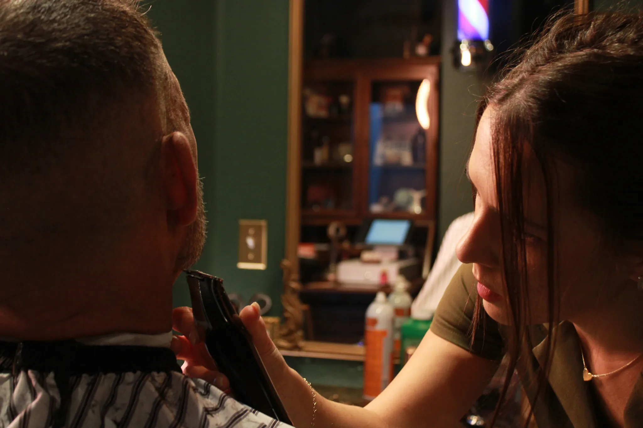 The barber chair and green styling room at Vintage Blade