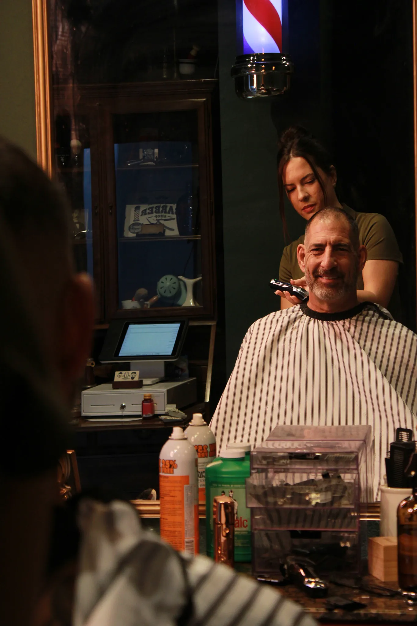 Details at Vintage Blade Barbershop — brass, mahogany and blades