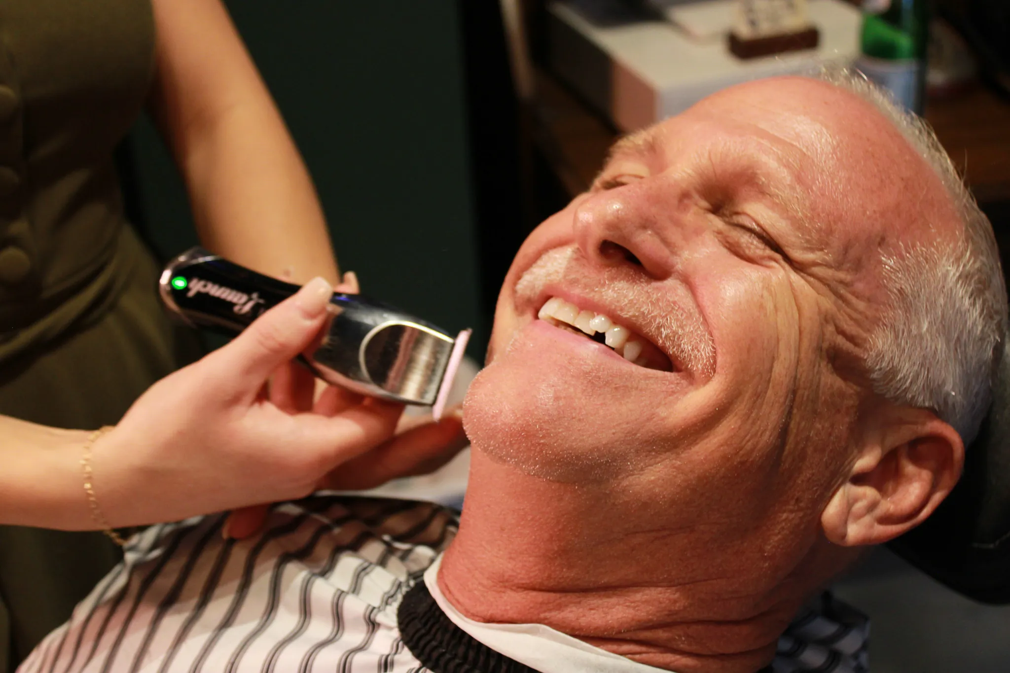 Details at Vintage Blade Barbershop — brass, mahogany and blades