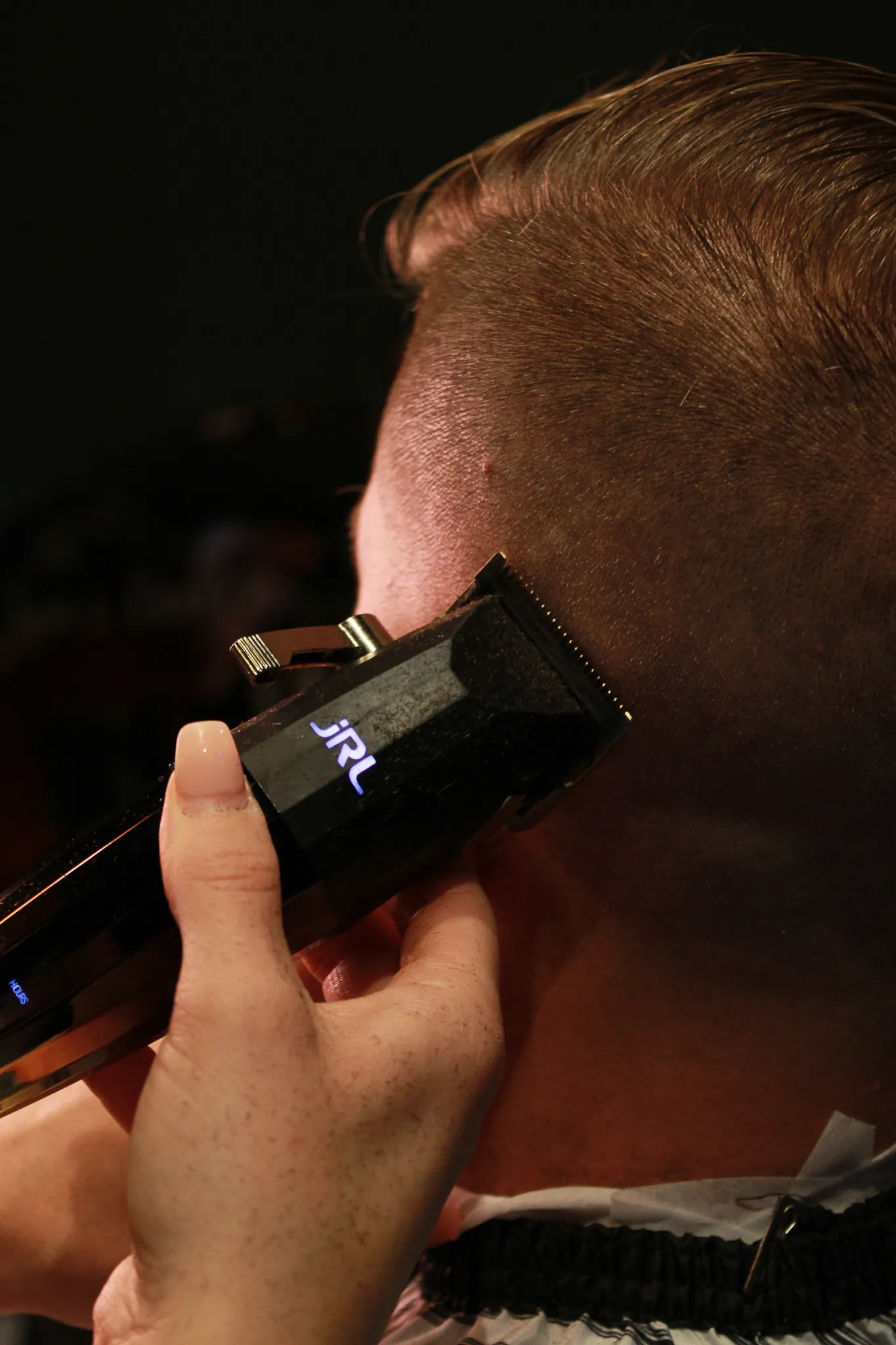Master barber Dixie at work at Vintage Blade in Bonita Springs